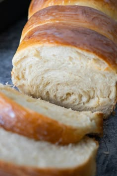 sliced loaf of bread sitting on top of a counter