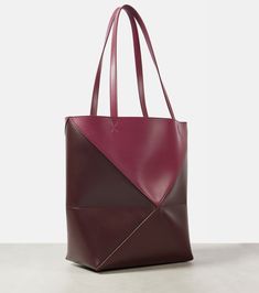 Puzzle Fold Medium leather tote bag in burgundy - Loewe | Mytheresa Designer Burgundy Leather Bags, Modern Burgundy Shoulder Bag With Dust Bag, Luxury Burgundy Bag In Soft Leather, Luxury Burgundy Bags In Soft Leather, Modern Burgundy Leather Bag, Modern Textured Leather Burgundy Bags, Modern Burgundy Textured Leather Bag, Modern Burgundy Textured Leather Shoulder Bag, Loewe Mini Puzzle Bag