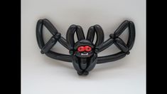 a sculpture of a spider with red eyes