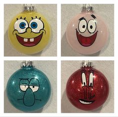 four christmas ornaments with cartoon faces on them