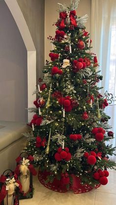 a christmas tree decorated with red and white ornaments