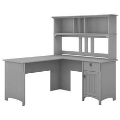 a computer desk with a hutch on the top and shelves above it, in front of a white background