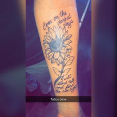 a sunflower tattoo with the words on it