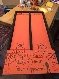 an orange table runner with spider races written on it and writing on the side that says, start spider races below 3 just your opponent