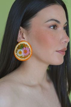 Preserved Dried orange slice with pressed flower embellishments clip on statement earring ! Orange Flower Earrings For Spring, Orange Flower Shaped Earrings For Party, Orange Flower Earrings For Party, Flower Embellishments, Orange Slice, Earring Ideas, Statement Earring, Orange Slices, Pressed Flower