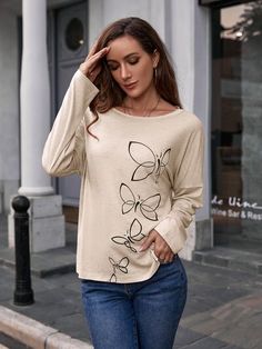 Features: Basic style  Sheer: Opaque  Stretch: Moderate stretch  Material composition: 95% polyester, 5% spandex  Care instructions: Machine wash cold. Tumble dry low.  Imported  Product measurements: S:Top Length 24.41 in, Sleeve Length 27.56 in, Bust 37.40 in M:Top Length 24.80 in, Sleeve Length 27.95 in, Bust 38.98 in L:Top Length 25.39 in, Sleeve Length 28.54 in, Bust 41.34 in XL:Top Length 25.98 in, Sleeve Length 29.13 in, Bust 43.70 in Beige Printed Long Sleeve Top, Casual Beige Printed Top, Trendy Printed Beige Tops, Beige Printed Tops With Relaxed Fit, Trendy Beige Printed Tops, Long Sleeve Printed Cream Tops, Cream Long Sleeve Printed Top, Flair Jeans, Butterfly Blouse