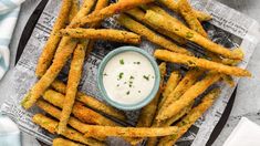 fried french fries with ranch dip on top