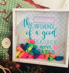 a framed sign that says the influence of a good teacher is never be based