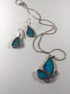 "These amazing set of butterfly earrings and necklace are very special as they are made from real butterfly wings!  They are reversible so you can see the colour on one side and browns on the underside. Very unique set for the butterfly lover!  Price is for the set of earrings and necklace. Size: Pendant - 18\" chain, pendant 1.5\" drop, Earrings 1 1/2\" drop Condition - Excellent MARKING: 950 To see my other jewelry, click here: https://etsy.me/3A8crke To go back to my shop home page, click her Nickel-free Sterling Silver Butterfly Necklace, Blue Butterfly Sterling Silver Jewelry, Silver Jewelry With Butterfly Charm, Silver Butterfly Jewelry With Matching Earrings, Unique Sterling Silver Jewelry With Butterfly Charm, Turquoise Butterfly Sterling Silver Jewelry, Unique Blue Butterfly-shaped Jewelry, Unique Blue Butterfly Jewelry, Unique Butterfly-shaped Jewelry With Matching Earrings