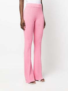 AERON ribbed-knit Flared Trousers - Farfetch Pink Ribbed Bottoms For Spring, Trendy Pink Ribbed Bottoms, Fitted Pink Bottoms With Ribbed Waistband, Pink Flare Pants For Loungewear, Casual Pink Knit Bottoms, Stretch Ribbed Pink Bottoms, Pink Stretch Bottoms With Ribbed Waistband, Pink Ribbed Stretch Bottoms, Pink Stretch Ribbed Bottoms