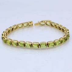 Indulge in the lush green beauty of our Peridot Tennis Bracelet, meticulously handcrafted in 18kt Yellow Gold. This exquisite piece of jewelry captures the essence of nature's freshness and combines it with the opulence of yellow gold, resulting in a bracelet that exudes sophistication and charm. Key Features: 🌿 Genuine Peridot Gemstones: Each peridot gemstone in this bracelet is ethically sourced and carefully chosen for its vibrant green hue and exceptional clarity. Peridot is a gemstone associated with vitality and abundance, making this bracelet a symbol of positive energy and style. 🌿 18kt Yellow Gold: The bracelet's setting and clasp are expertly crafted from 18kt yellow gold, adding a touch of timeless elegance and luxury to the design. Yellow gold's warmth complements the green o Bracelet Packaging, Peridot Jewelry, Mens Tennis, Bracelet Mens, Birthstone Bracelet, August Birthstone, Wedding Jewelry Bracelets, Peridot Gemstone, Birthstone Bracelets