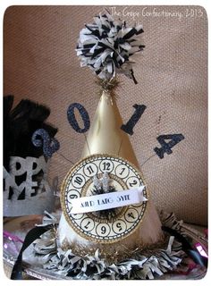 a party hat with a clock on it