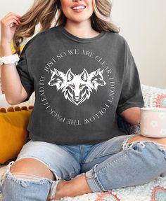 Unleash your inner strength with our "Alpha Male Wolf" T-shirt. This fierce and powerful graphic tee features a majestic wolf design that symbolizes dominance and leadership. Crafted from high-quality, comfortable fabric, it's perfect for nature enthusiasts, adventure seekers, and anyone who embodies the spirit of an alpha. Whether you're exploring the great outdoors or making a bold statement in a casual setting, this T-shirt is your go-to choice for showcasing your fearless style. Embrace your wild side and let the world know that you are the leader of the pack. Thank you for your interest in our shirts! ♥︎SIZING♥︎ Kindly consult the size chart provided. To ensure a precise fit, measure your favorite T-shirt from armpit to armpit and top to bottom, then compare these measurements with th Graphic Tee With Wolf Design, Short Sleeve, Wolf Design Graphic Tee With Short Sleeves, Graphic Tee With Wolf Design Short Sleeve, Black Wolf Design Short Sleeve Top, Black Crew Neck Top With Wolf Design, Black Short Sleeve Top With Wolf Design, Black Cotton Top With Wolf Design, Alpha Male Wolf, Majestic Wolf