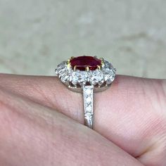 This ring features a cushion cut natural non-heated Burma ruby, weighing 1.46 carats and set in 18k yellow gold prongs. The center stone is certified by AGL. A halo of old mine cut diamonds surrounds the center stone. Old European cut diamonds are set along the shoulders, which are decorated with fine milgrain. The total diamond weight of this ring is 1.70 carats. This ring is carefully handcrafted with a platinum mounting.
The center stone is a 1.46 carat non-heated Burma ruby, certified by AGL Estate Diamond Jewelry, Ring With Diamond, Ruby Stone, European Cut Diamonds, Platinum Ring, Perfect Engagement Ring, Ruby Ring, Diamond Halo, Unique Engagement Rings