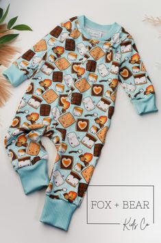 The Happy S'mores Romper! These rompers are a great, soft and comfortable addition to your baby's wardrobe! These rompers are available in multiple adorable prints, so you are sure to find something you love! They are crafted from a stretchy rib knit fabric that is custom printed in the USA. The colors are vibrant and the material is soft and cozy. This romper is perfect for everyday wear! Don't see it? Looking for a specific pattern print? Message me! I would love to custom make something speci Cute Brown Cotton Onesie, Unisex Playful Onesie For Loungewear, Cute Cartoon Print Onesie For Loungewear, Outdoors Outfits, Baby Camping, Manhattan Ks, Baby Sleepers, Rib Knit Fabric, Camping Outfits