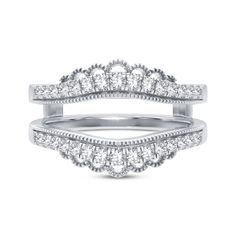 two white gold wedding bands with diamonds on each band and one diamond in the middle