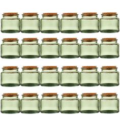 six glass jars with cork lids are lined up