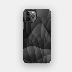 an iphone case with black and white shapes