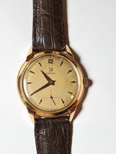 OMEGA Men's 18K Gold cal. 265 Dress Watch 37mm circa 1940's, Swiss -- in perfect condition Vintage Yellow Gold Analog Watch Accessories, Vintage Yellow Gold Watch Accessories For Business, Vintage Watch Accessories With Polished Finish For Business, Vintage Brown Watch Accessories For Formal Occasions, Mens Wrist Watches, Omega Man, Dress Watches, Watch Vintage, Dress Watch