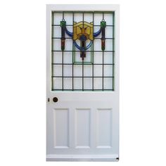 a white door with a stained glass window