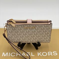 Michael Kors Double Zip Wristlet Powder Blush Brand New With Tag Nwt Michael Kors Jet Set Travel Double Zip Large Wallet Wristlet Color: Powder Blush Multi Goldtone Hardware Material: Mk Signature Coated Canvas And Saffiano Leather Measures: 7.25” W X 4.5” H X 1” D Snap Closure 2 Zip Pocket Id Window Pocket 6 Credit Card Slots Slip Compartment Phone Compartment Detachable Wristlet Strap Cream Wallets With Zipper Closure, Michael Kors Wristlet Wallets, Michael Kors Pink Pouch Bag, Elegant Pink Michael Kors Wallet, Michael Kors Pink Wallet, Michael Kors Pink Wallet With Zipper Closure, Large Wallet, Michael Kors Jet Set, Zip Pockets