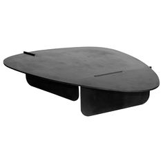 a black table with an oval shaped top