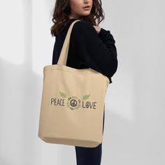 This aesthetic shoulder bag is made of strong, organic fabric and looks great. It has two straps that make it easy to carry, and it can be used as a cool purse, canvas lunch bag, and a canvas makeup bag. You can take it with you when you go to work, school, or even when you have a picnic in the park. It's perfect for a day at the beach too! You can put your towel, sunscreen, sunglasses, and a book inside.   It makes a fantastic book lover gift or can be used as a knitting bag.  The best part is that this bag is good for the environment. Instead of using plastic bags that we throw away, this bag can be used over and over again. It's made from organic cotton, which means it's grown without bad chemicals. Farmers use natural things to help the cotton grow and keep bugs away. When you use this Eco-friendly Canvas Shoulder Bag For Daily Use, Organic Tote Bag For Everyday, Organic Tote Bag For Daily Use, Eco-friendly Beige Canvas Shoulder Bag, Organic Rectangular Canvas Bag For Everyday Use, Organic Everyday Tote Bag, Everyday Organic Tote Bag, Everyday Organic Rectangular Bag, Daily Use Canvas Bags With Eco-friendly Ink