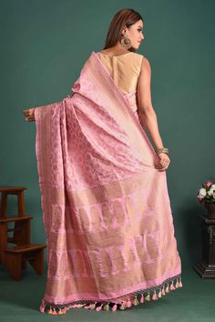 Go for demure elegance at parties and festive occasions in this stunning light pink Banarasi Katan silk saree. The saree has a zari border and pallu. It comes with a matching blouse piece. Disclaimer: The shown stitched blouse on the model is for display purpose only. The saree comes with a matching blouse piece and finished with fall and piko. Pink Handloom Raw Silk Pre-draped Saree, Elegant Pre-draped Pink Tussar Silk Saree, Elegant Pink Pre-draped Tussar Silk Saree, Pink Tussar Silk Saree With Zari Weaving, Pink Tussar Silk Pre-draped Saree With Zari Weaving, Pink Banarasi Silk Pre-draped Saree, Pink Tussar Silk Blouse Piece With Zari Weaving, Elegant Pink Pre-draped Saree With Zari Weaving, Pink Raw Silk Saree With Zari Weaving