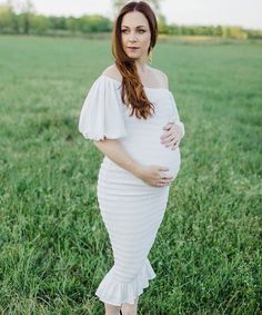 Our best-selling maternity dress for a trendsetting #momtobe. Features a luxurious smocked body, lantern-style sleeves (worn on or off-the-shoulder), bodycon fit, and below-the-knee-length with ruffle details. Wear during and after pregnancy! Available in colors White, Mauve, Light Blue and Siren Red. Maternity & Postpartum wear 100% Polyester Fully Lined Size Chart. For a bodycon fit, size down, for a loose fit, size up. Questions? Need two sizes? Chat with a stylist using the chat icon! Maternity Stores, Chat Icon, Pre Pregnancy, After Pregnancy, Maternity Dress, Postpartum, Dress White, Maternity Dresses, Stretch Fabric