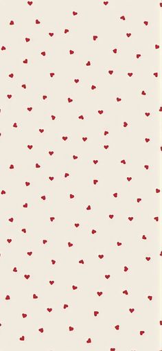 a white and red wallpaper with small hearts on the bottom half of it,