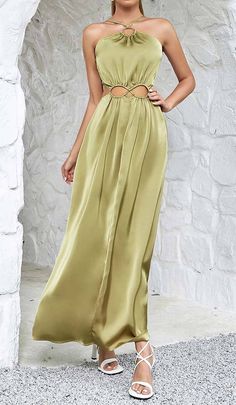 Captivate the room in this olive green satin maxi dress designed with a skin-baring rectangular waist cutout. The slim shoulder straps and floor-grazing skirt provide an elegant contrast to the provocative cutout. Strut your stuff at formal events in this scene-stealing stunner. Gentle Dry Clean Only Colour may vary due to lighting on images. The product images (without model) are closest to the true colour of the product.Item runs true to size chart and is cut to suit our size chart. Please ref Elegant Spring Maxi Dress With Cut-out Waist, Elegant Green Dress With Cutout Details, Elegant Green Cutout Dress, Green Spaghetti Strap Maxi Dress For Evening, Summer Evening Maxi Dress With Cut-out Waist, Green Satin Chic Maxi Dress, Olive Maxi Dress For Party, Chic Green Maxi Dress With Cutout, Elegant Olive Maxi Dress For Spring