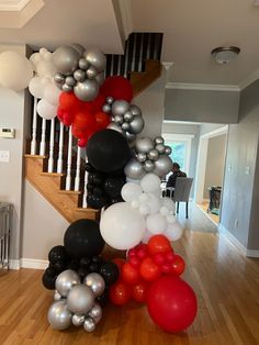 the staircase is decorated with balloons and streamers