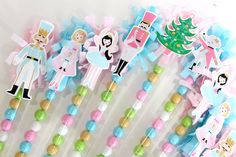 there are many candy sticks with princesses on them