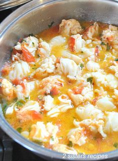 the food is being cooked in the pot on the stove top and ready to be eaten