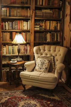 a chair in front of a bookshelf with a lamp on top of it