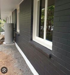 the side of a house that has been painted gray