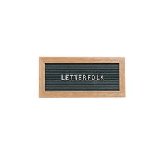 a wooden sign that says letterfolk on it's black and wood frame