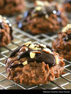 cookies with chocolate and nuts on a cooling rack