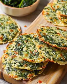 spinach and cheese fritters on a cutting board