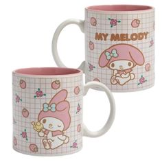 two coffee mugs with hello kitty designs on the front and back of each cup