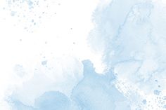 a blue and white watercolor background with spots