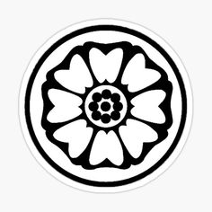 a black and white flower in a circle