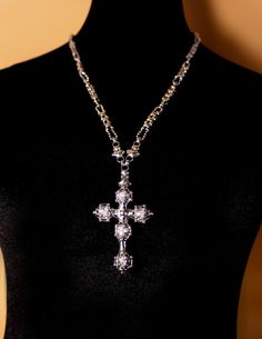 This is an exceptional cross made of Swarovski crystal balls. The SG Liquid Metal design by Sergio Gutierrez comes on a delicate famous handcrafted “CH1” Chain link made completely of ball chain. It’s a glamorous cross. Allow 3 working days for the orders to be shipped on special edition Items. Antique silver finish Limited edition antique silver finish only sold in this website 5 crystal Swarovski balls caged cross Handmade Lobster clasp closure Available size: chain 22” Hard fine black box wit Spiritual Silver Necklaces With Rhinestones, Silver Crystal Crucifix Jewelry, Silver Beaded Cross Jewelry, Crystal Balls, Liquid Metal, Metal Cross, Black Box, Metal Design, Ball Chain