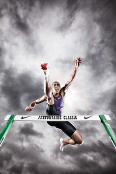 a man jumping in the air over a hurdle