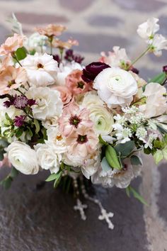 a bouquet of flowers sitting on top of a table