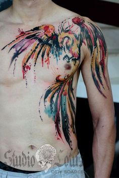 a man with a bird tattoo on his chest is standing in front of the camera