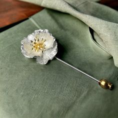 Introducing our exquisite Silver Poppy Flower Brooch Pin, a timeless accessory that effortlessly blends elegance with nature-inspired beauty. This handcrafted brooch is a celebration of delicate craftsmanship and the grace of the poppy flower, making it a perfect addition to your jewelry collection or a thoughtful gift for a loved one. Crafted from high-quality sterling silver, the brooch features a meticulously detailed poppy flower design that captures the essence of nature in every petal. The Silver Flower Brooch With Floral Decoration, Silver Flower Lapel Pin, Silver Flower Brooches With Flower Decoration, Silver Flower Brooch With Flower Decoration, Silver Flower Shaped Lapel Pin Brooch, Silver Flower Shaped Brooch With Floral Decoration, Elegant Flower Lapel Pin For Anniversary, Elegant Flower Shaped Lapel Pin For Anniversary, Elegant Flower Shaped Anniversary Lapel Pin