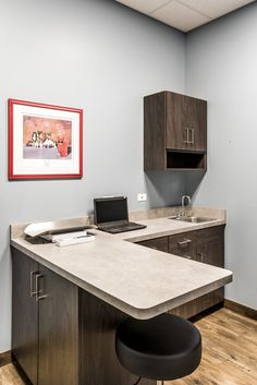 an office desk with a laptop on it