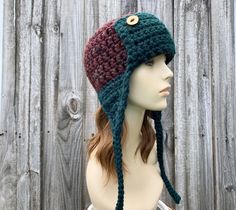 a mannequin head wearing a crocheted hat