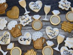 decorated cookies are arranged on a wooden table